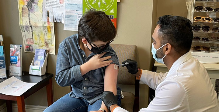 Staff administering Covid Vaccine